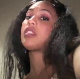 An attractive black girl video-records herself taking a shit while sitting on a toilet from a between the legs perspective. About 7 minutes.